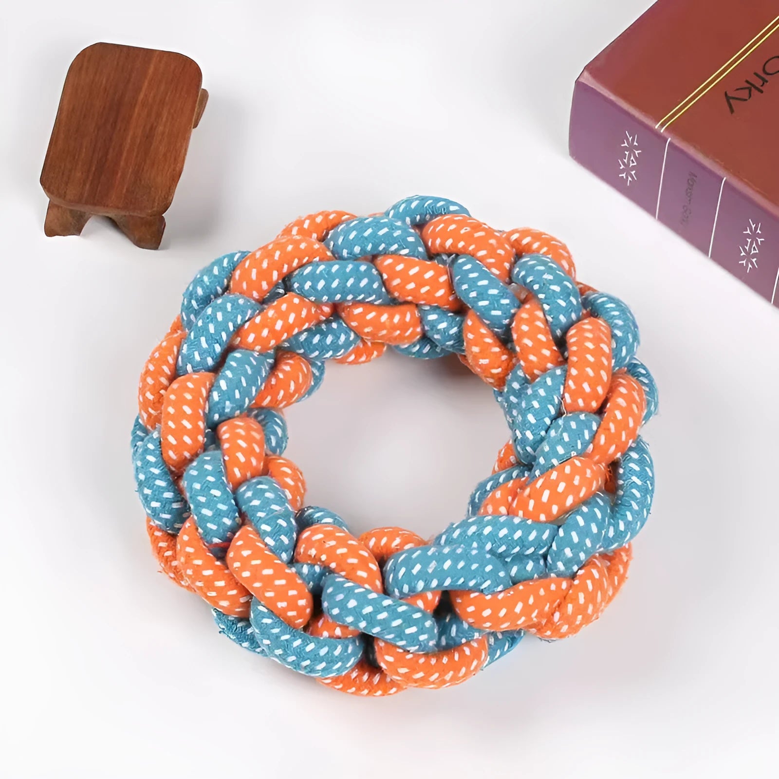 Cotton braided ring dog chew toy approximately 18cm in diameter with knot details