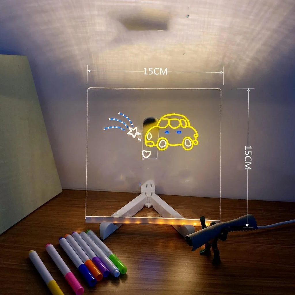 Acrylic LED message board night light on a desk with colourful handwritten notes glowing softly.