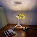 Acrylic LED message board night light on a desk with colourful handwritten notes glowing softly.