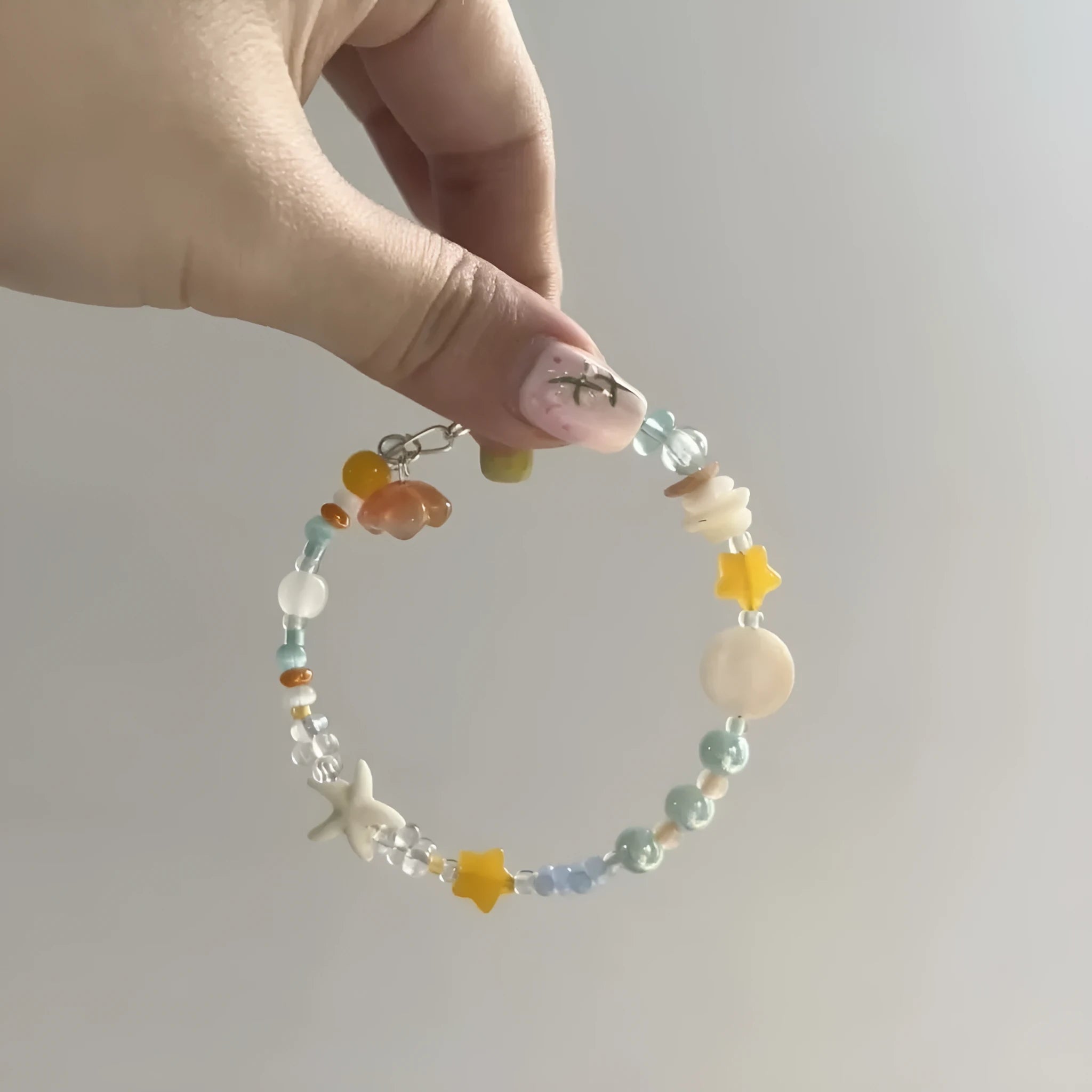 Mixed-material orange sea summer bracelet with diamond shape and round alloy elements