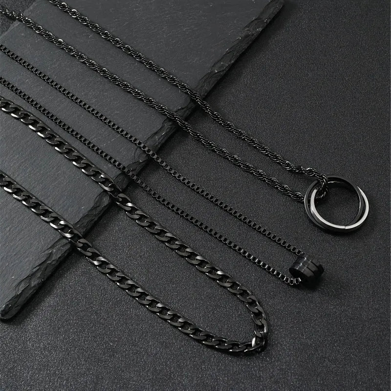 Men's black titanium steel ring buckle necklace set with three matching geometric stainless steel chains.