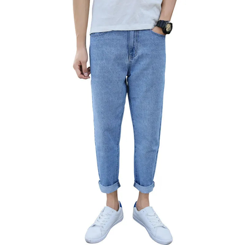 Men's black loose straight harem jeans showing casual fit and light straight leg opening