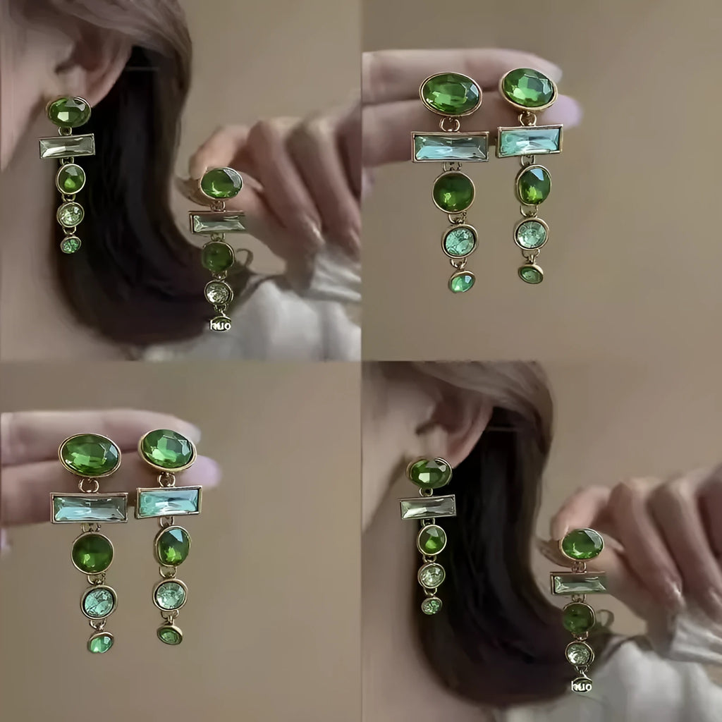 A pair of green gradient tassel earrings with a geometric shape and inlaid zircon detail.