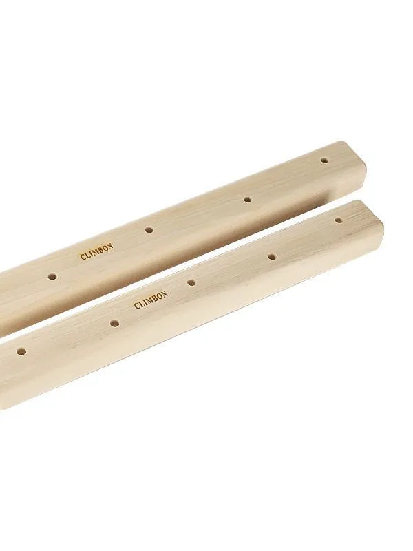 Set of three solid wooden fingerboards for grip strength training on a wall