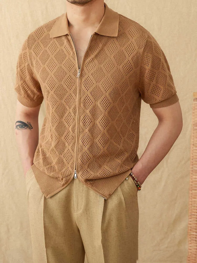 Man wearing a light brown, short sleeve cotton cardigan with a front zipper and lapel collar.