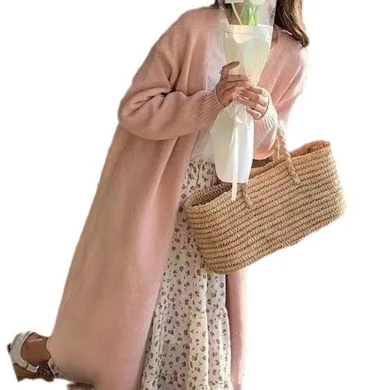Women's khaki knitted v-neck cardigan with long sleeves on a hanger.