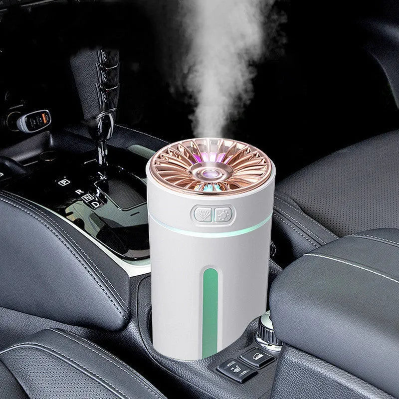 Black portable USB rechargeable humidifier with colourful LED lights on a car cup holder