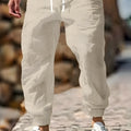 Men's straight leg cotton linen trousers with elastic waist in Army Green colour.