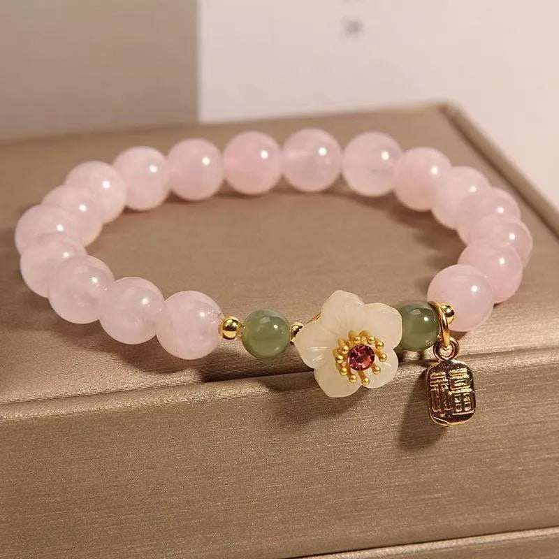 Crystal Hetian jade beaded peach blossom bracelet with camellia motifs and fruit charms in blessing card colour