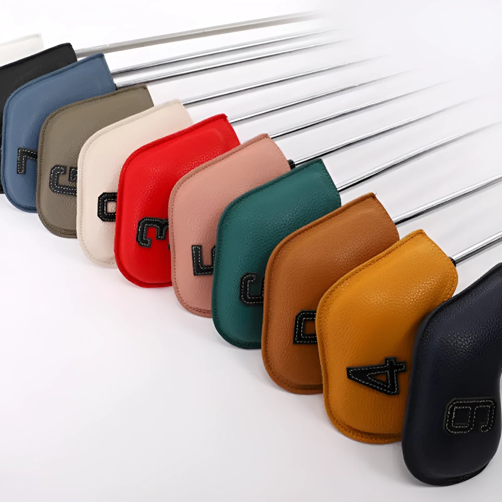 Set of 10 digitally printed PU golf club head covers in assorted designs.