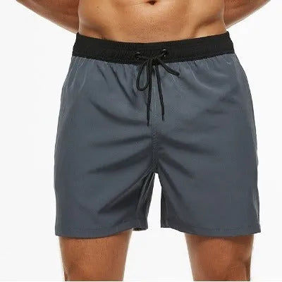 Men's blue running shorts with a stitching waistband, drawstring, and zipper pocket.