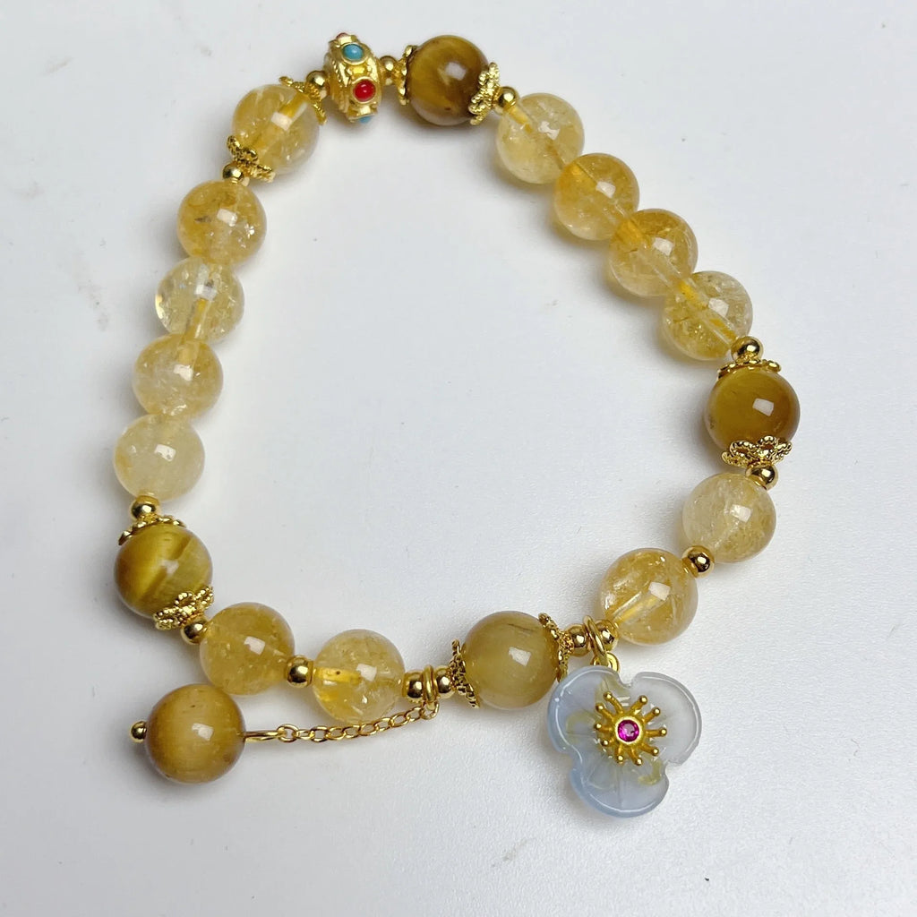 Women's citrine-coloured crystal bracelet with handcrafted flower tassel design