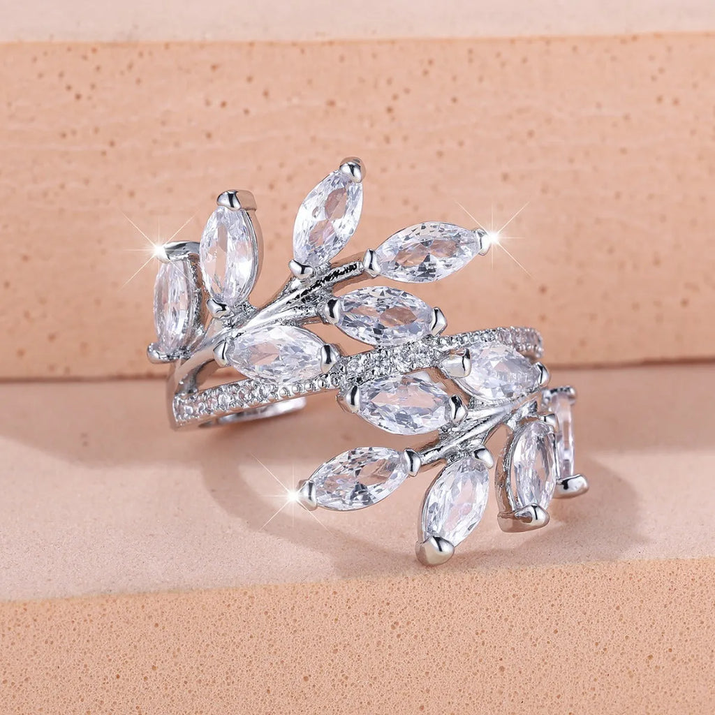 Close-up of an adjustable horse eye zircon leaf fashion ring in a rose gold finish with white stones.