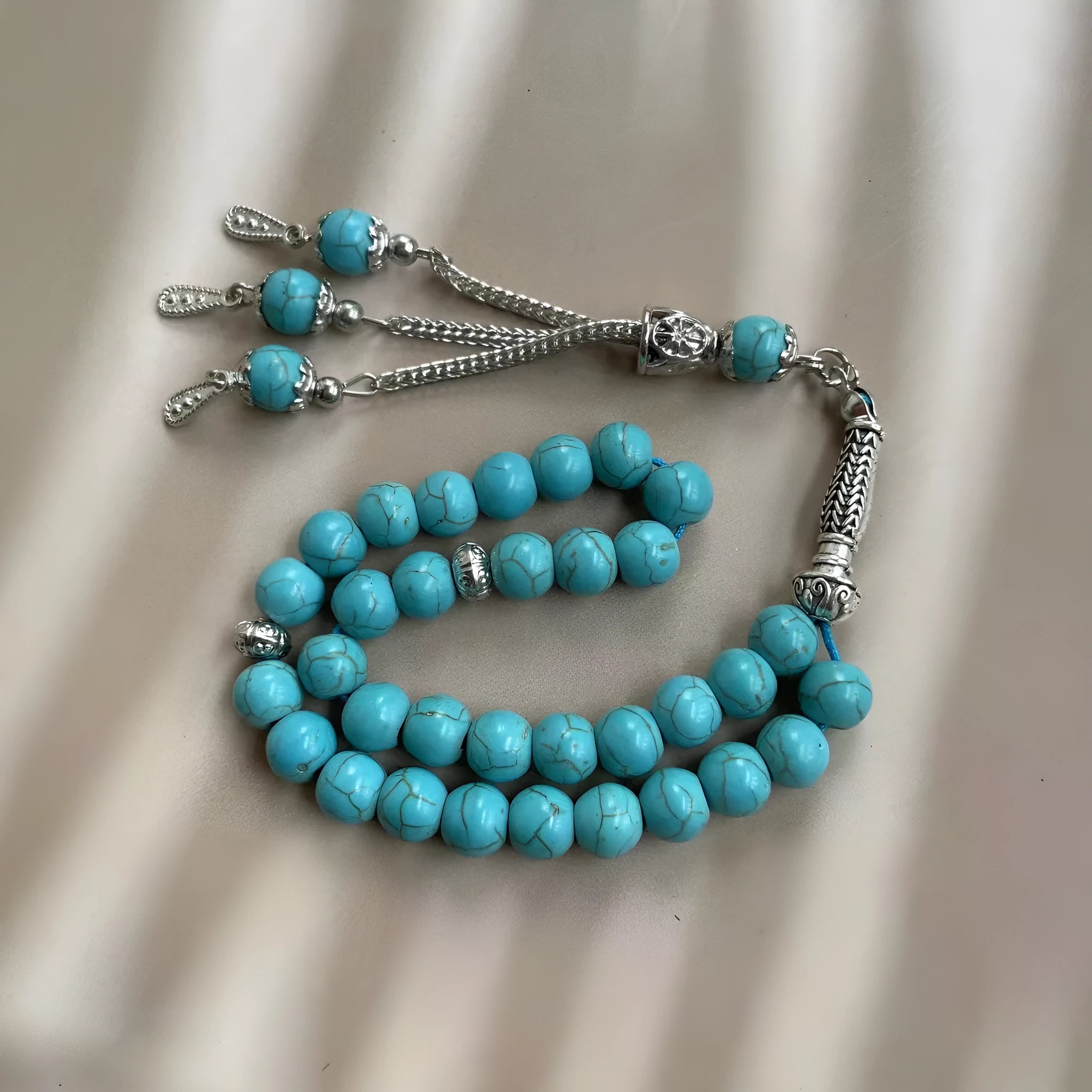 Handmade sky blue stone bead Muslim prayer bracelet for daily worship and dhikr counting.