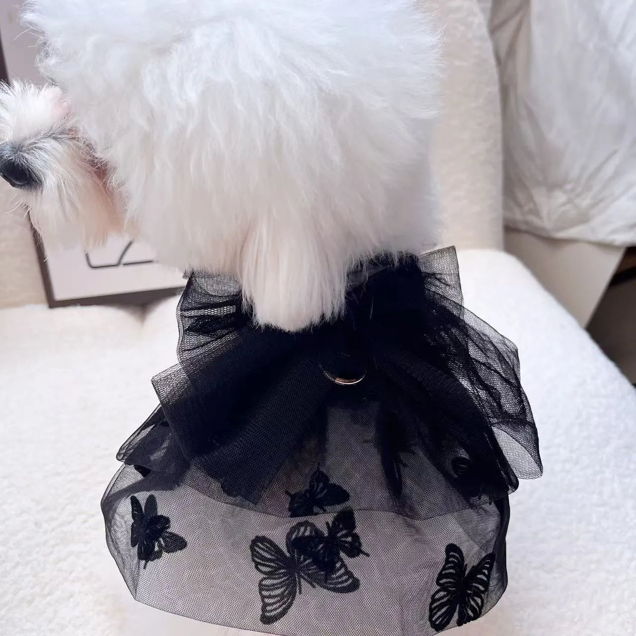 Black gauze princess skirt for a small dog on a mannequin, showing tulle material.