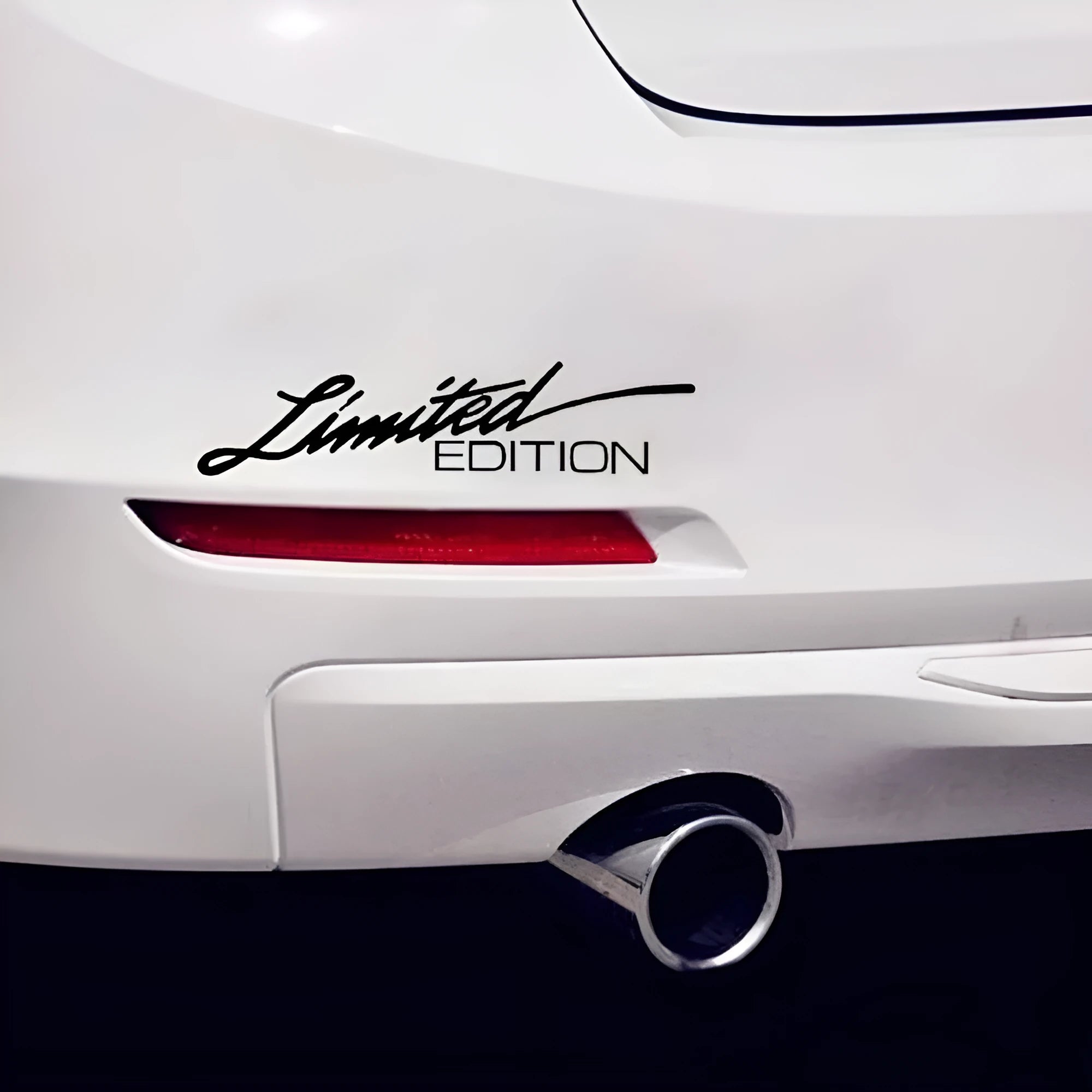 Reflective plastic bumper sticker in black, white, and colourful options showing 16cm by 3.8cm size.