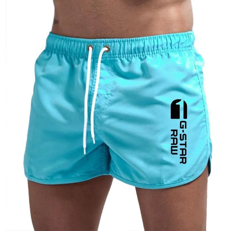 Men's thin hemp-blended polyester sport shorts in multiple colours on a mannequin, showing elastic waistband.