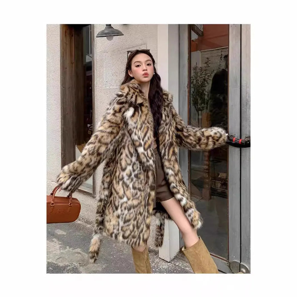 Long faux fur coat with fur collar and pockets in artificial fur fabric