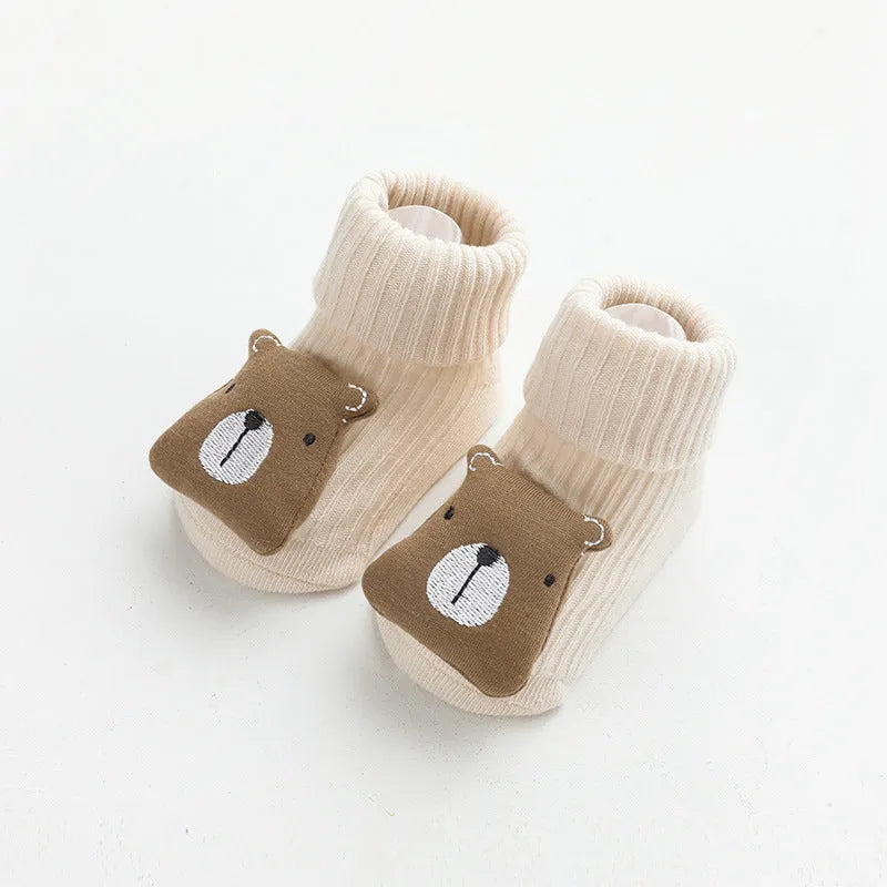 Baby socks with anti-slip glue dots on soles in combed cotton, showing mid-tube height and various colour options
