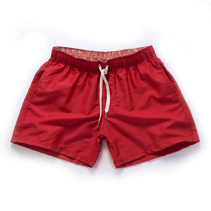 Men's straight leg beach shorts in polyester fabric available in multiple colours and sizes