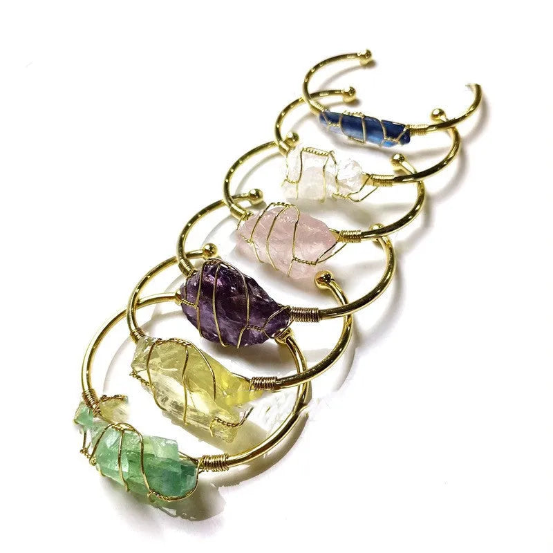 Geometric bracelet made of natural rough crystal stones wrapped with gold-coloured wire
