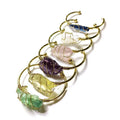 Geometric bracelet made of natural rough crystal stones wrapped with gold-coloured wire