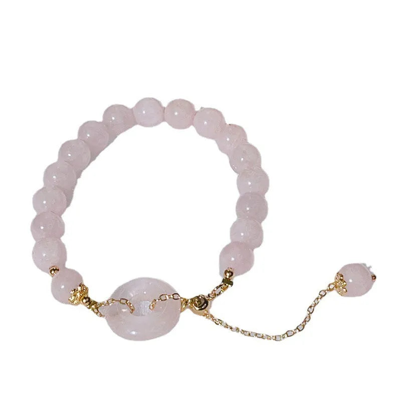 Pink crystal peace buckle bracelet with safety clasp on silver-coloured chain