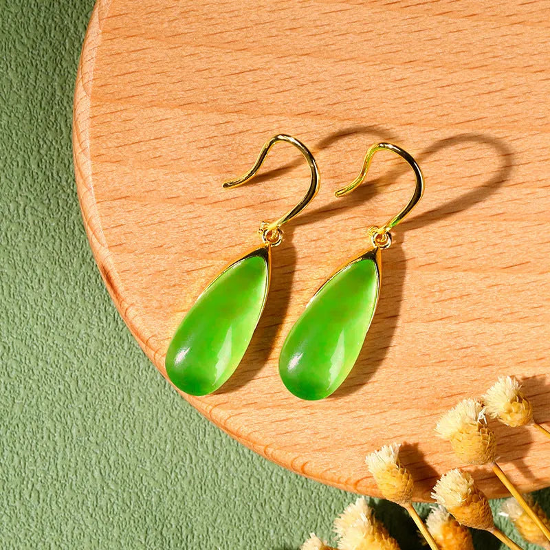A pair of jade green geometric water droplet earrings in a Chinese style with an electroplated copper finish.