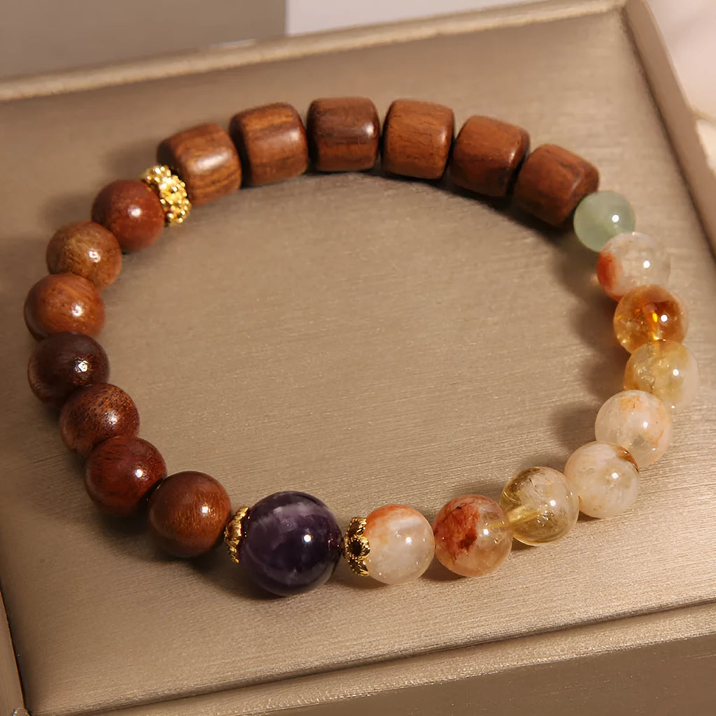 Women's bracelet with yellow tower crystal and amethyst beads, pearl and rhinestone accents