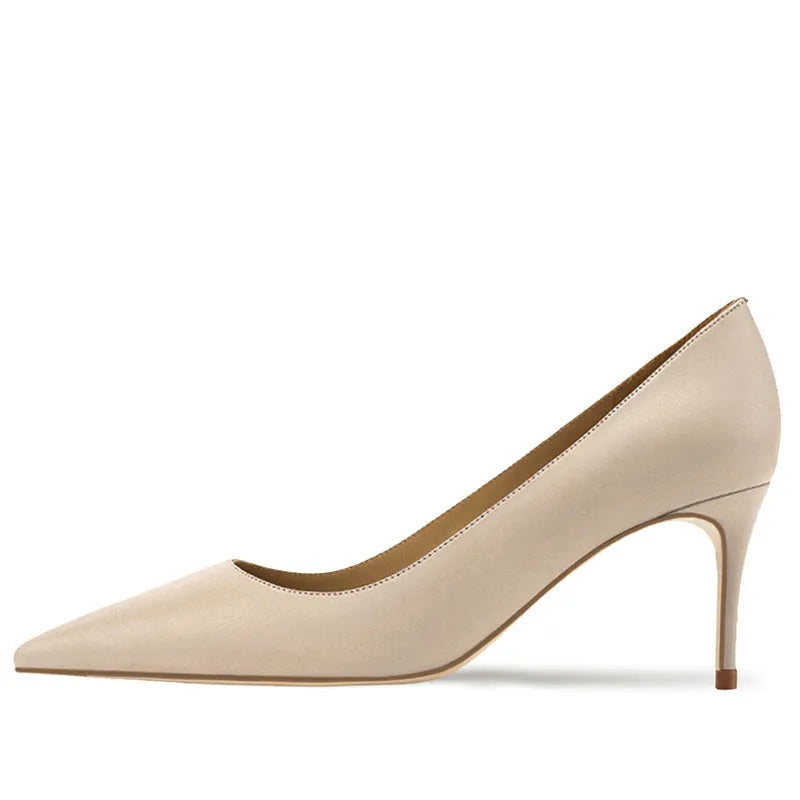 Women's black pointed toe slip-on pump with a kitten heel on a soft rubber sole.