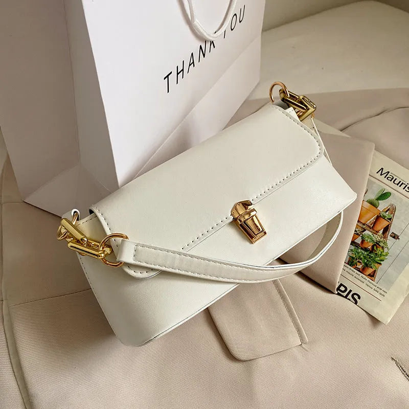 Brown French casual underarm bag with single shoulder chain strap and sandwich pocket design
