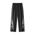 Men's loose fit straight-leg trousers in black, featuring an elasticated waist and button fly.