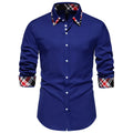 Man wearing a blue plaid long sleeve shirt with a triangle collar in a casual cardigan style.