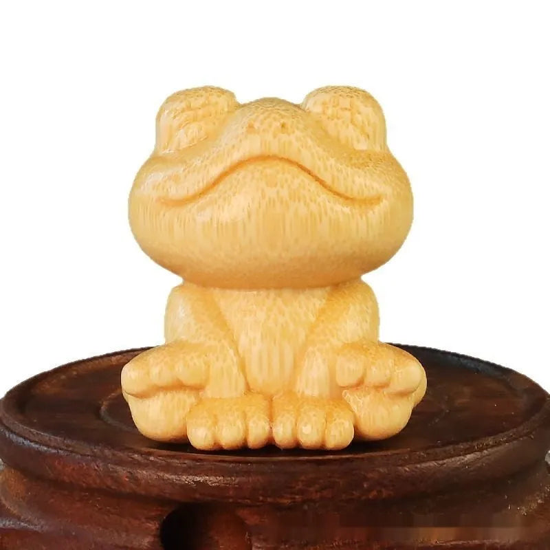 Solid bamboo smiling frog carving ornament measuring 5cm high with cartoon design