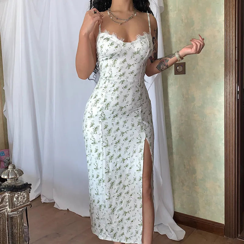 Women's long lace floral print dress with front slit and suspender straps in blue.