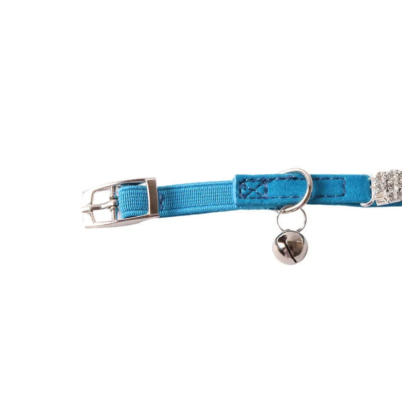 Colourful flannel-pattern cat collar with elastic buckle on a white background.
