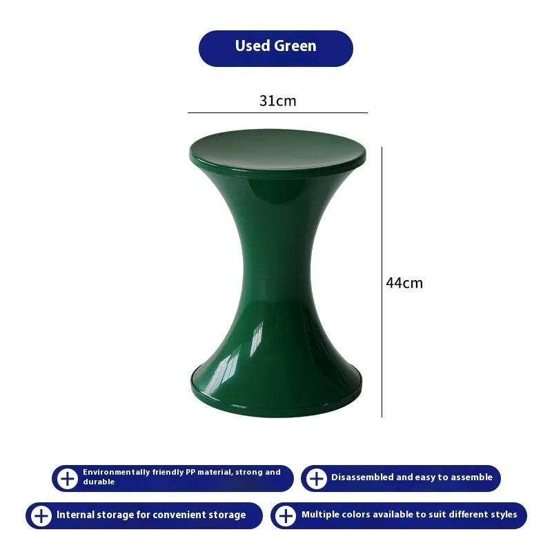 Creative hourglass-shaped plastic stool for changing shoes, shown in a green colour.