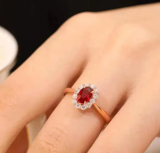 Gold pigeon blood ruby sterling silver ring with floral design and artificial gemstone centre