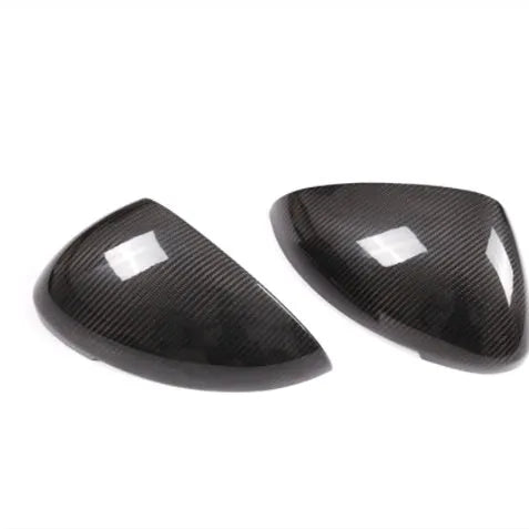 Black true carbon fibre rearview mirror covers for 14-22 Porsche Macan with visible weave texture