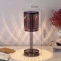 Modern crystal table lamp with a diamond-faceted shade on a metal stand, showing amber colour option.