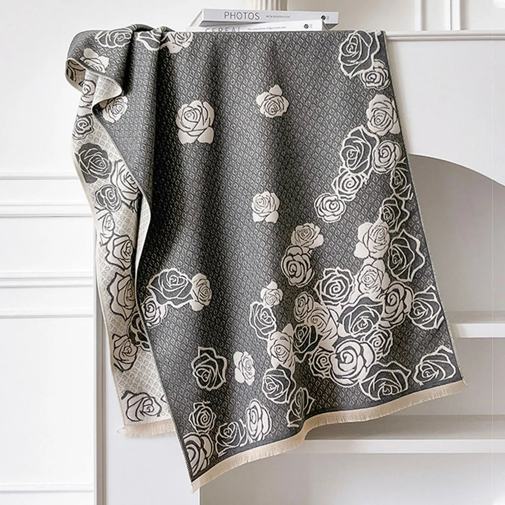 Long grey cashmere-like winter scarf with tassels, shown draped to display its length and texture.