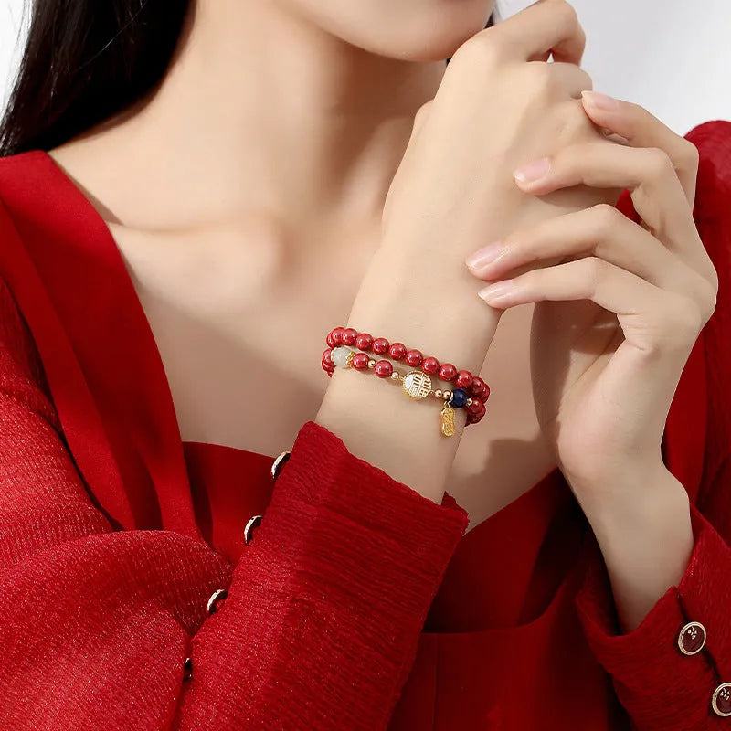 S925 sterling silver bracelet with purple gold sandstone charm, white shell card, and red cinnabar details.