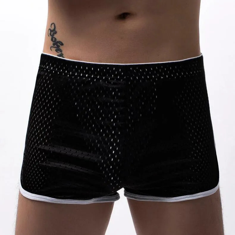 Men's three-point boxers in a cotton and nylon blend, shown in black, on a mid-waist fit model.