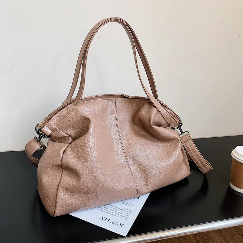 Large khaki soft PU messenger bag with long strap, shown open with internal phone and zipper pockets.