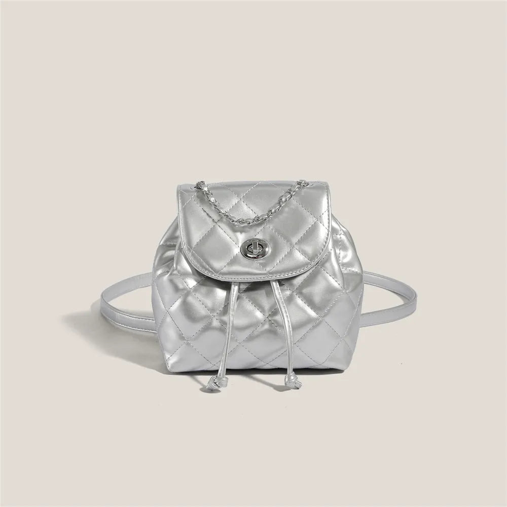 Women's rhombus plaid pattern PU leather backpack in silver colour with package cover closure.