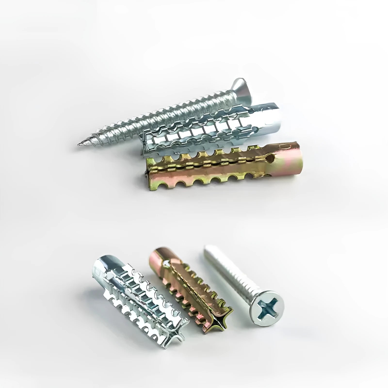 Metal Christmas tree barbed expansion tube screws in various sizes for concrete and brick walls.