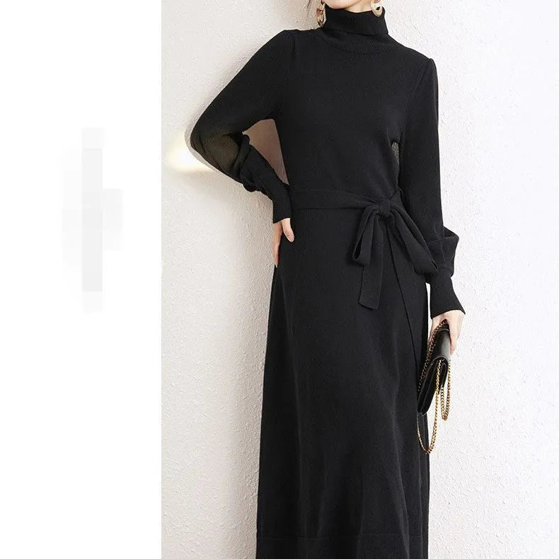 Rose red turtleneck knit dress with long sleeves, elastic waist, and a flared midi-length skirt.