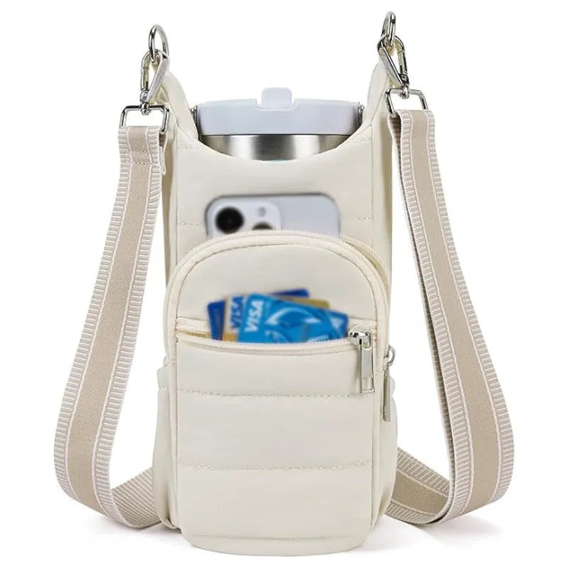 Cloth bicycle water bottle bag in beige, black, or pink colour on a bike frame.