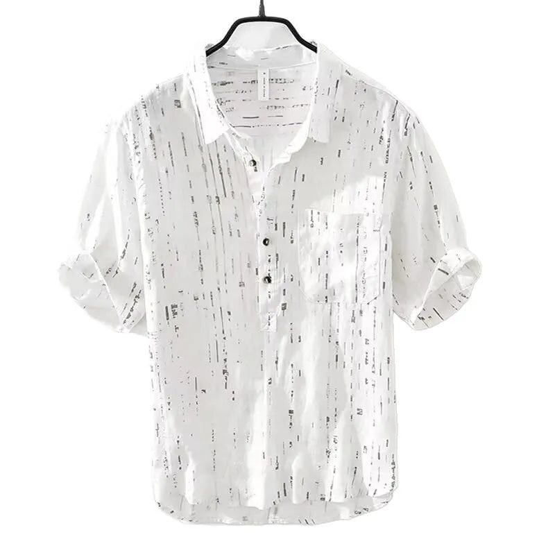 Man wearing a loose-fit black short-sleeve polo shirt, a summer casual style.