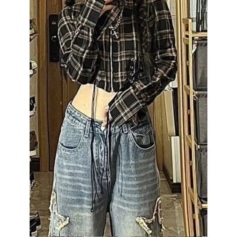 Blue high-waisted women's wide-leg denim trousers on a plain background